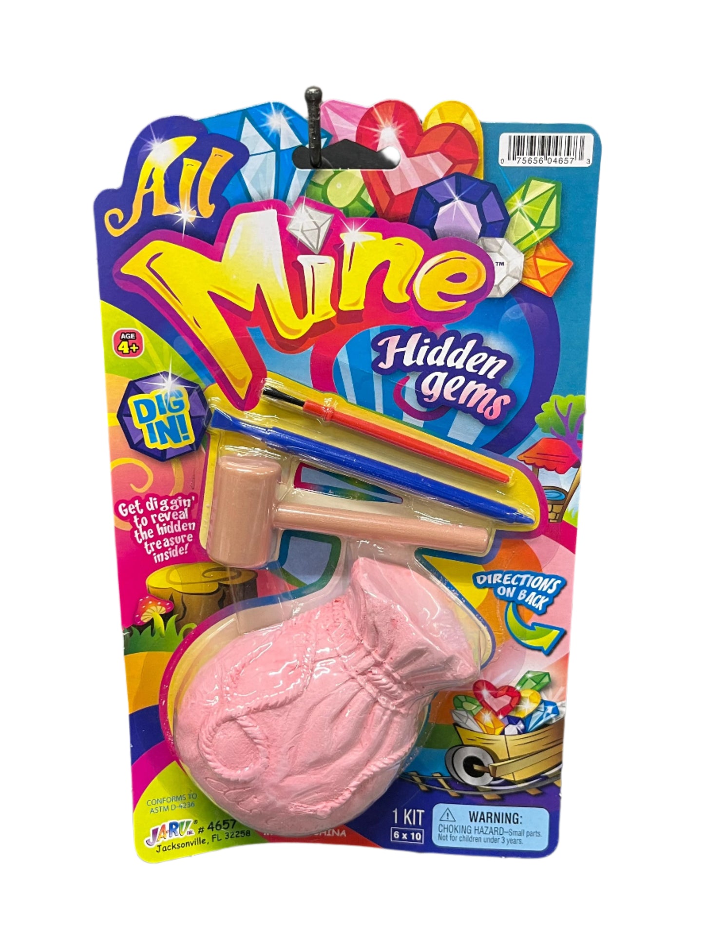 Packaged toy with pink object and colorful 'All Mine Hidden Gems' branding.