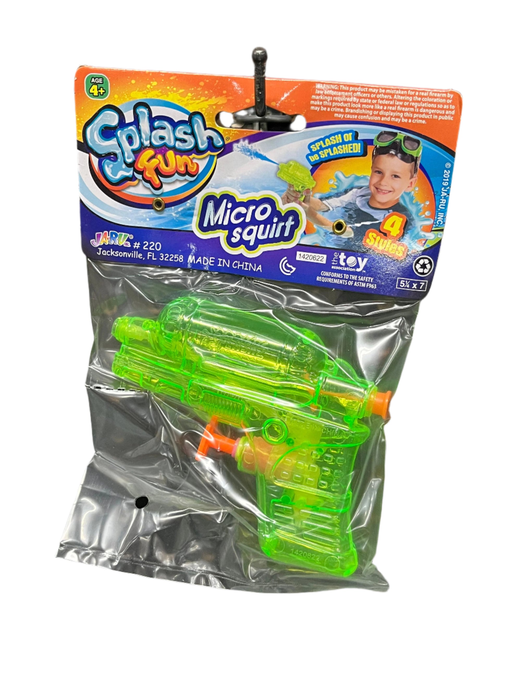 Green water gun in packaging 