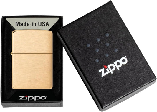 Gold Zippo lighter in a black box with 'Made in USA' and Zippo logo.